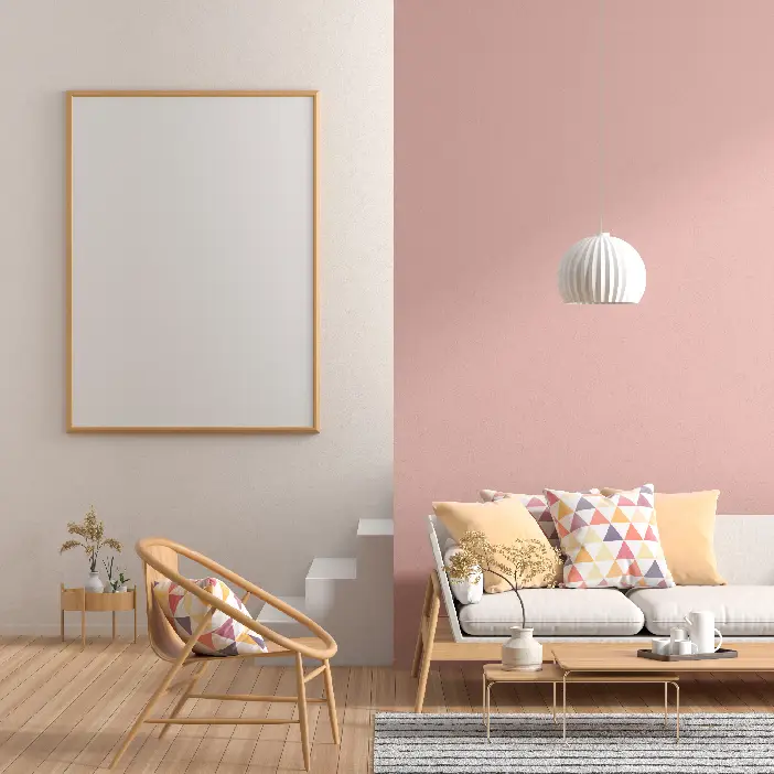 Relaxed-coastal living-room interior design in Fort Myers featuring a soft blush accent wall