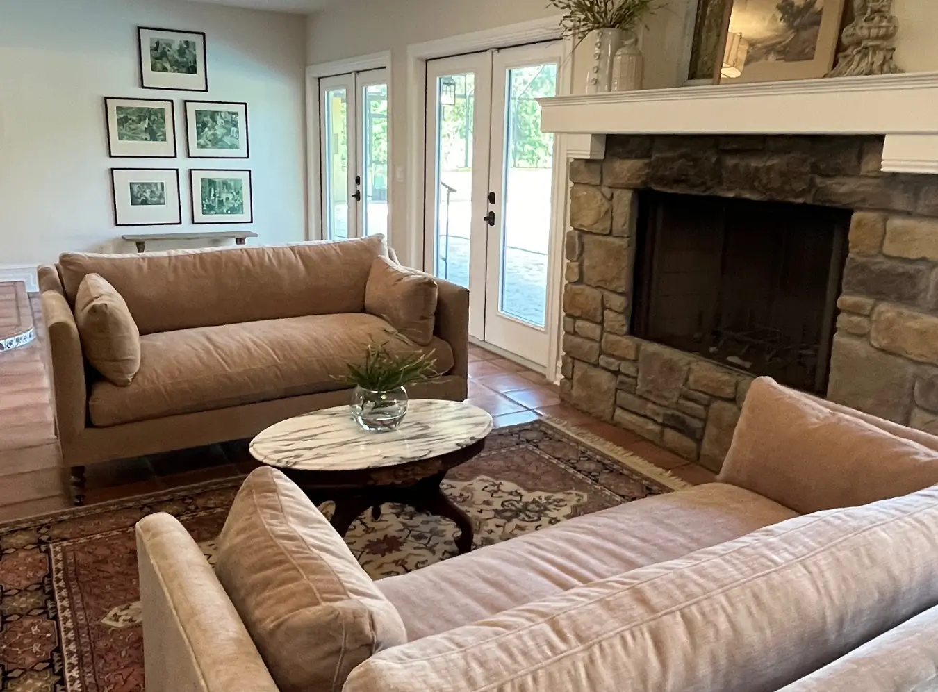 fort myers organic modern transitional living room interior design featuring natural stone fireplace and neutral furnishings a way of life banner